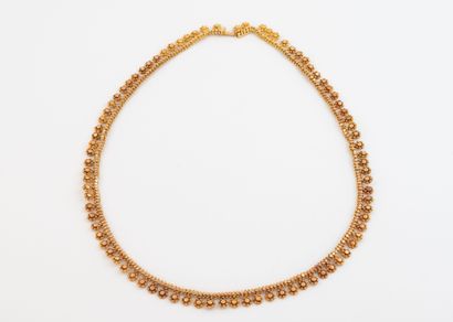 Yellow gold (750) necklace with daisy-shaped...