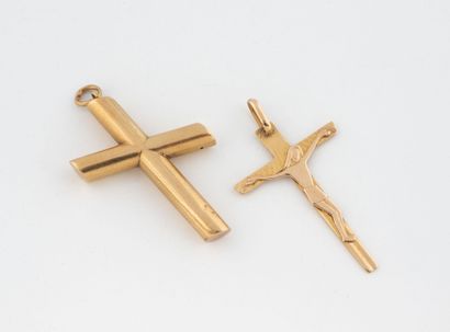 Two cross pendants in yellow gold (750),...