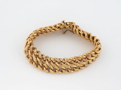 Double-mesh bracelet in yellow gold (750).
Ratchet...