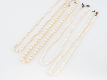 Lot of four white cultured pearl necklaces,...
