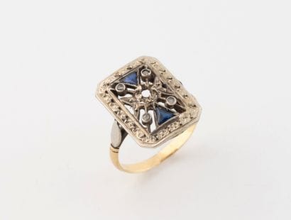 Yellow and white gold (750) ring centered...