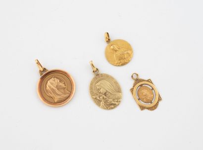 Lot of four round and oval religious medals...