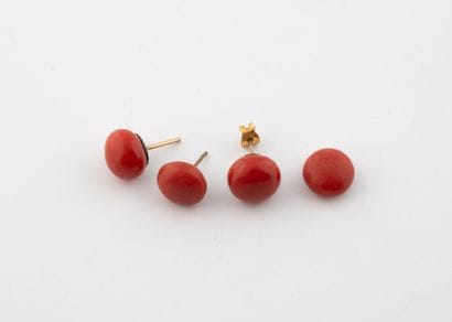 A pair of gold-plated metal earrings adorned...