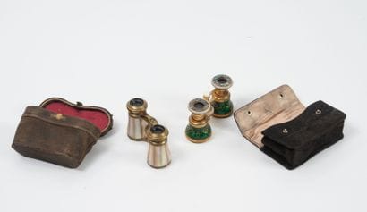 Two pairs of theater binoculars, in their...