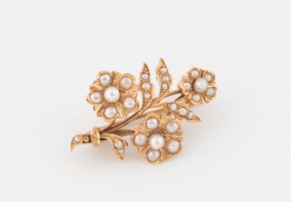 Yellow gold (750) brooch in the shape of...