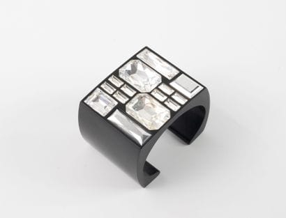SWAROVSKY
Open-worked black plastic bracelet...