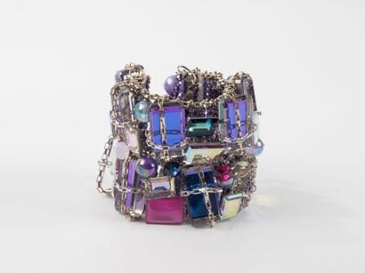 Metal cuff bracelet with rows of small purple...