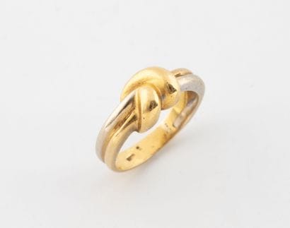 Small knot ring in yellow and white gold...