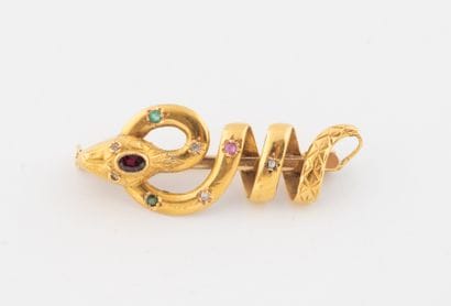 Snake brooch in yellow gold (750) set with...