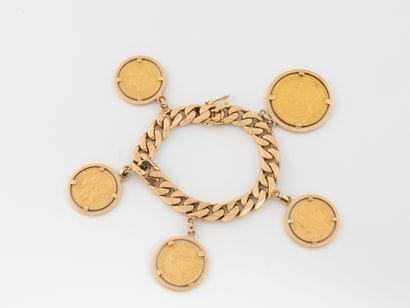 Yellow gold (750) curb chain bracelet adorned...