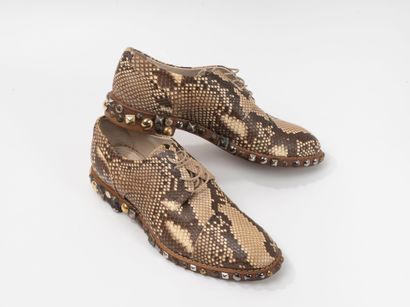 LOUIS VUITTON
Paire de derby en python
Semelle...