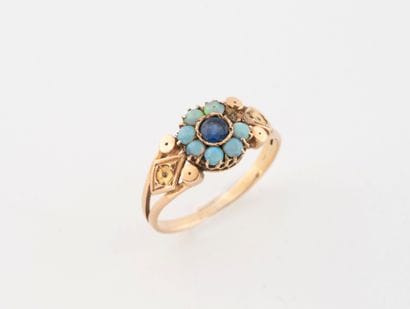 Yellow gold (750) daisy ring set with a blue...