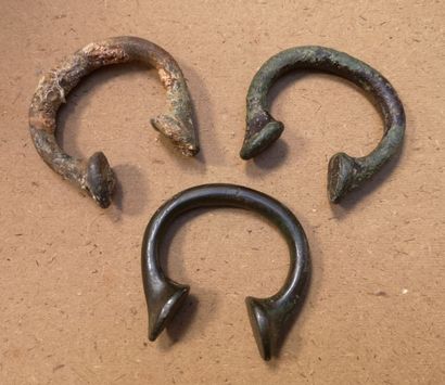 Two rectangular lead sinkers, one with a...