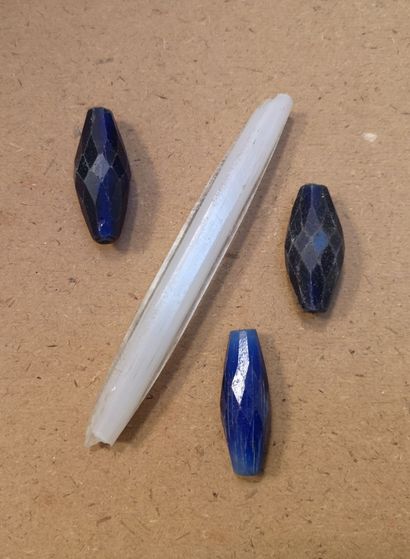 Two rectangular lead sinkers, one with a...