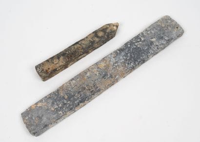 Two rectangular lead sinkers, one with a...