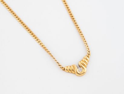 Yellow gold (750) necklace set with a small...