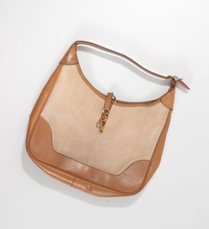 HERMES
Sac Trim en toile et cuir naturel...