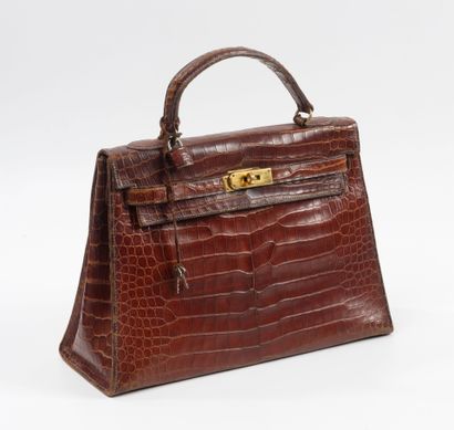 HERMES Paris
32 cm Kelly bag in fawn porosus...