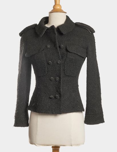 CHANEL
Veste courte en tweed noir.
Double...