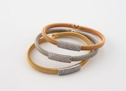 GEMME
Three open-work bracelets in three-tone...