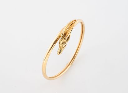 Yellow gold (750) bangle bracelet decorated...