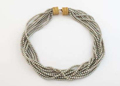 Necklace with ten strands of small gray pearls.
Yellow...