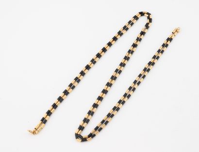 Two-row necklace in yellow gold (750), adorned...