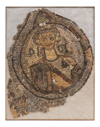 Medallion depicting a draped, full-face bust....