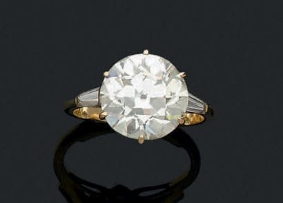 Belle bague solitaire en or jaune (750) centré...