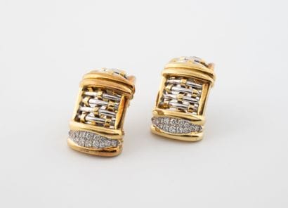 Pair of earrings in yellow and white gold...