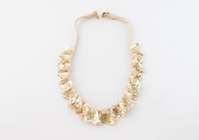 Necklace featuring a cordon and medallions...