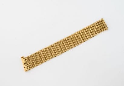 Articulated ribbon bracelet in yellow gold...
