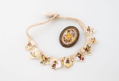 Necklace featuring a cord and medallions...