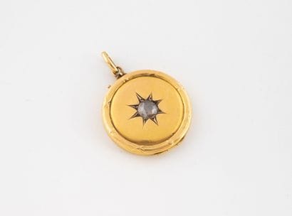 Circular yellow gold photo pendant centered...