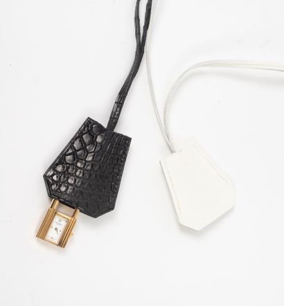 HERMES 
Padlock-shaped bagwatch in gilded...