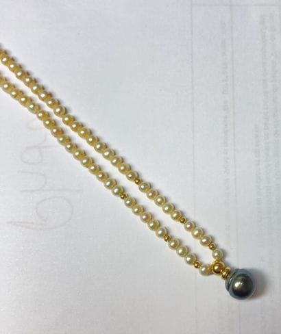 Necklace with a strand of white cultured...
