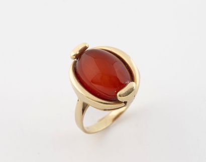 Yellow gold (585) ring set with an oval cabochon...