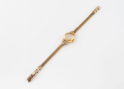 KODY 
Round-cased ladies' wristwatch in yellow...