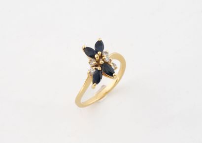 Yellow gold ring set with four sapphires...