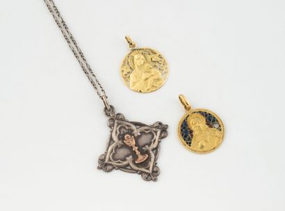 Two round religious medals in openwork yellow...