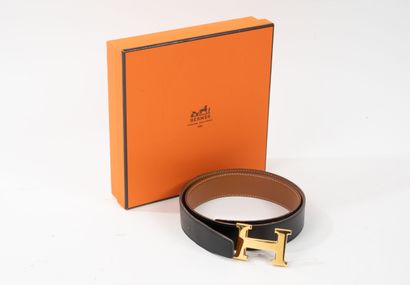 HERMES
Black and gold reversible leather...