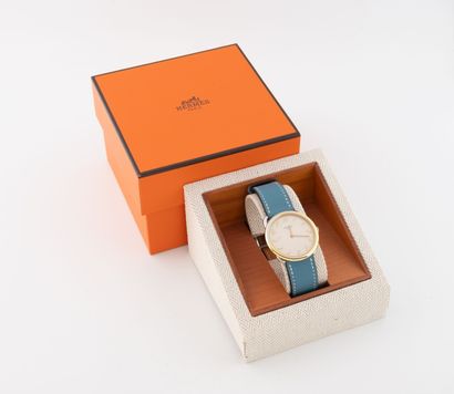 HERMES Arceau
Watch in gilt metal and steel.
Round...