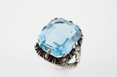 Ring set with a beautiful emerald-cut aquamarine...