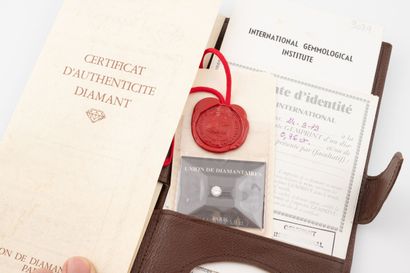 Brilliant-cut diamond on paper under seal.
Weight...