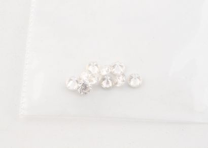 Ten small diamonds on paper.
Total weight:...
