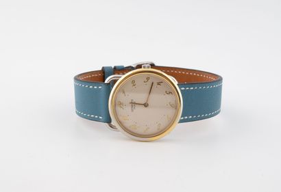 HERMES Arceau
Watch in gilt metal and steel.
Round...