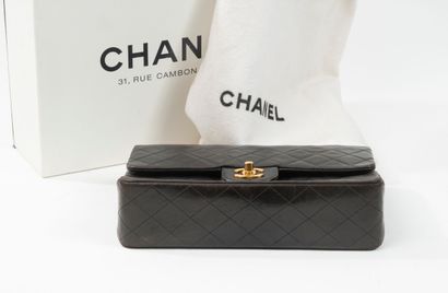 CHANEL
Classic bag with double flap in black...
