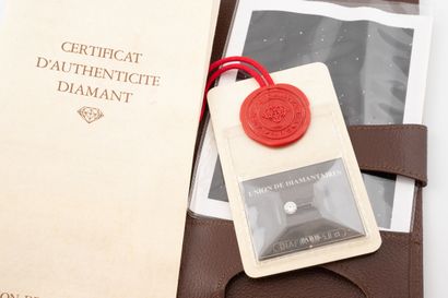 Brilliant-cut diamond on paper under seal.
Weight:...