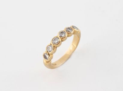 Half-American wedding band in yellow gold...