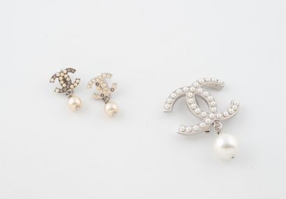 CHANEL
Steel half-set comprising a pair of...